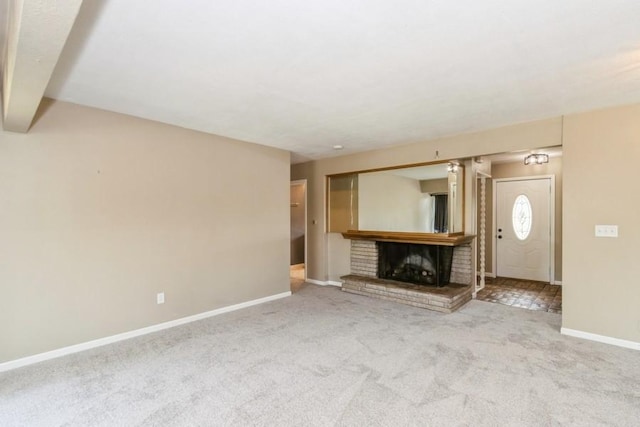 2175 Chandler St SW, Cedar Rapids, IA 52404 - unfurnished living room with carpet and a brick fireplace