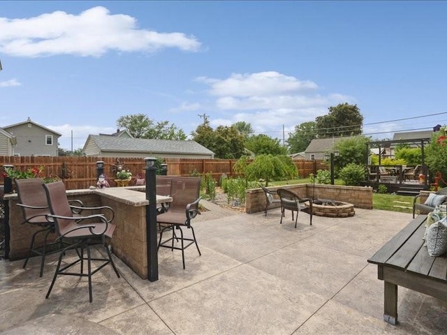 1418 8th St NW, Cedar Rapids, IA 52405 - fenced backyard featuring a fire pit and a patio
