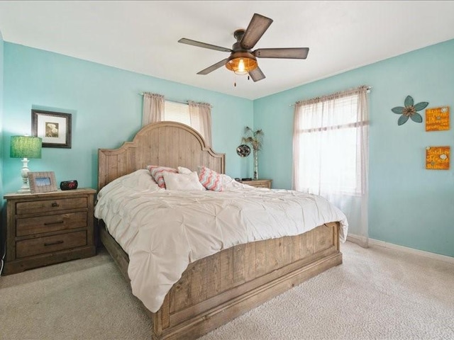 1418 8th St NW, Cedar Rapids, IA 52405 - carpeted bedroom featuring baseboards and ceiling fan