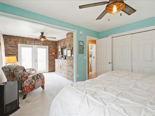 1418 8th St NW, Cedar Rapids, IA 52405 - carpeted bedroom with french doors, ceiling fan, and access to outside