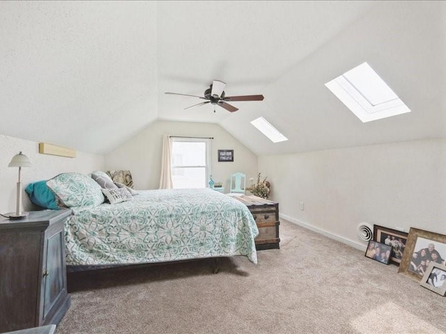 1418 8th St NW, Cedar Rapids, IA 52405 - carpeted bedroom featuring a skylight, lofted ceiling, and ceiling fan