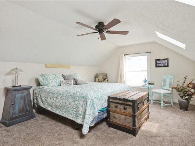 1418 8th St NW, Cedar Rapids, IA 52405 - carpeted bedroom with vaulted ceiling, a skylight, and ceiling fan