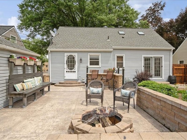 1418 8th St NW, Cedar Rapids, IA 52405 - back of property with a patio area, an outdoor fire pit, and roof with shingles