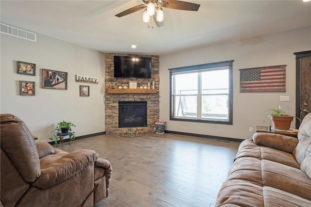 1602 Bridge Creek Ct, Marion, IA 52302 - living area featuring a ceiling fan, a fireplace, wood finished floors, and recessed lighting