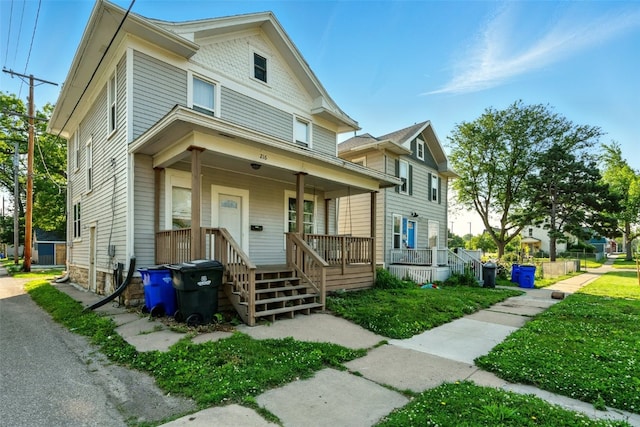 216 15th St NE, Cedar Rapids, IA 52402 - view of front facade featuring covered porch