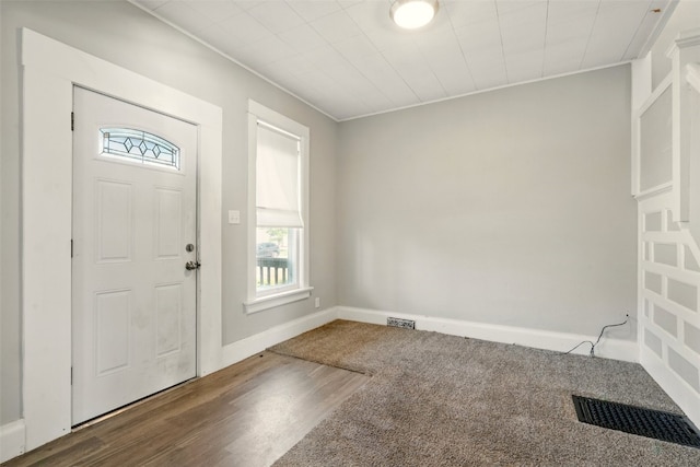 216 15th St NE, Cedar Rapids, IA 52402 - entryway featuring plenty of natural light, wood finished floors, and crown molding