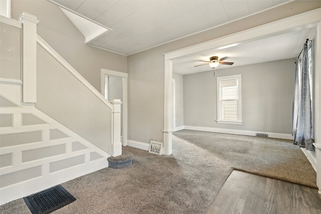 216 15th St NE, Cedar Rapids, IA 52402 - carpeted foyer featuring stairs and a ceiling fan