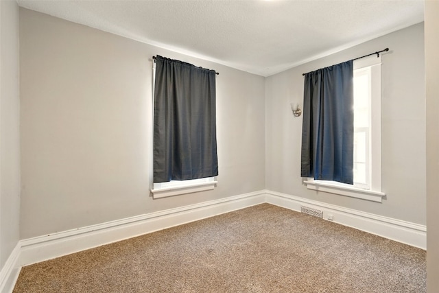 216 15th St NE, Cedar Rapids, IA 52402 - spare room featuring carpet and healthy amount of natural light
