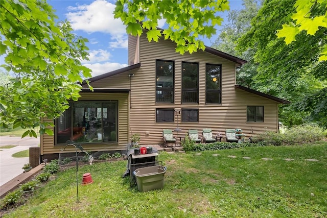 2145 Coldstream Ave NE, Cedar Rapids, IA 52402 - back of property with a yard and a chimney