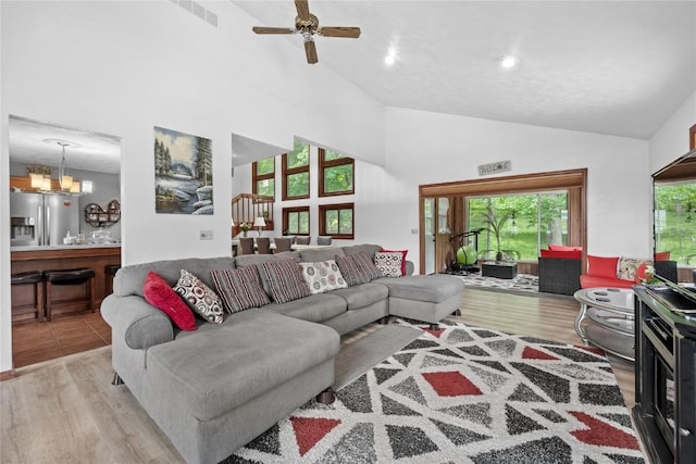 2145 Coldstream Ave NE, Cedar Rapids, IA 52402 - living area with high vaulted ceiling, wood finished floors, ceiling fan, a chandelier, and recessed lighting