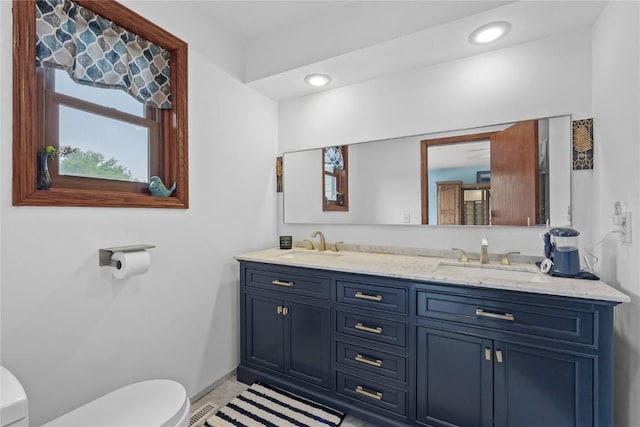 2145 Coldstream Ave NE, Cedar Rapids, IA 52402 - bathroom with double vanity and recessed lighting