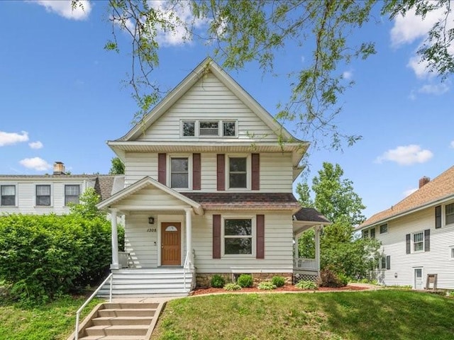 1308 A Ave NW, Cedar Rapids, IA 52405 - traditional style home featuring covered porch and a front yard