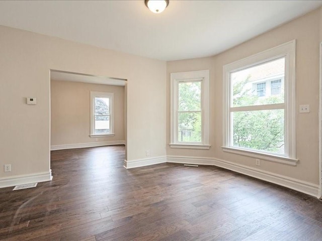 1308 A Ave NW, Cedar Rapids, IA 52405 - unfurnished room featuring dark wood-style floors and baseboards
