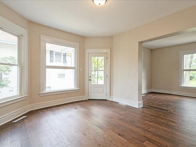 1308 A Ave NW, Cedar Rapids, IA 52405 - unfurnished room with dark wood-type flooring and baseboards