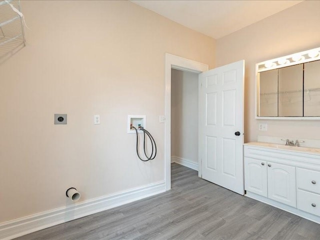 1308 A Ave NW, Cedar Rapids, IA 52405 - laundry room with washer hookup, light wood-type flooring, and hookup for an electric dryer