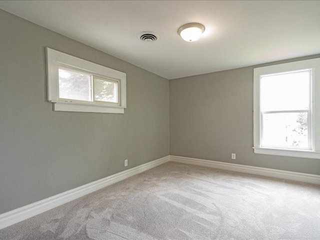 1308 A Ave NW, Cedar Rapids, IA 52405 - spare room with healthy amount of natural light and light carpet