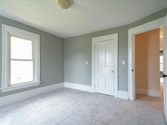1308 A Ave NW, Cedar Rapids, IA 52405 - unfurnished bedroom with carpet flooring and multiple windows