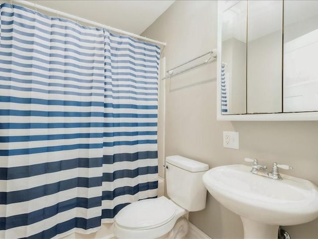 1308 A Ave NW, Cedar Rapids, IA 52405 - bathroom with a sink and a shower with shower curtain