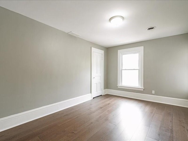1308 A Ave NW, Cedar Rapids, IA 52405 - empty room with dark wood-style floors and baseboards