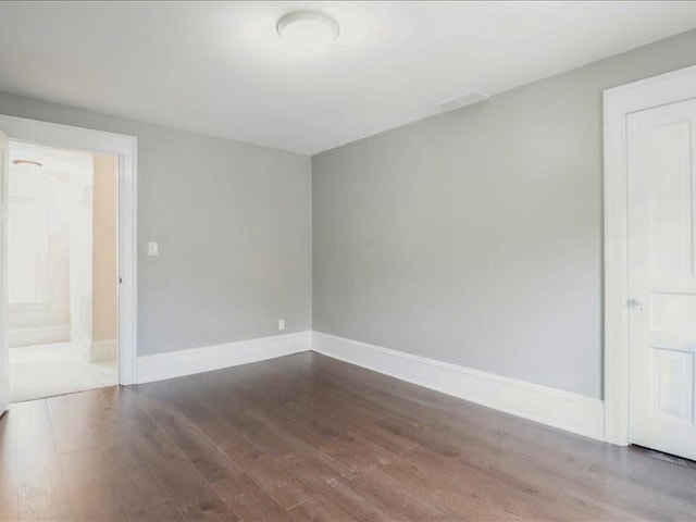 1308 A Ave NW, Cedar Rapids, IA 52405 - spare room featuring wood finished floors and baseboards