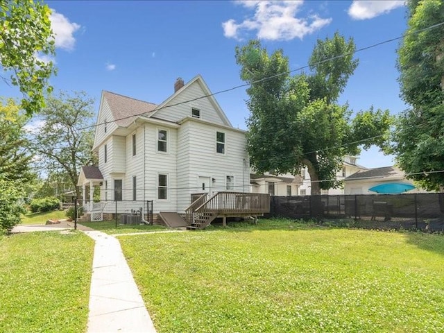 1308 A Ave NW, Cedar Rapids, IA 52405 - rear view of house with a deck and a chimney