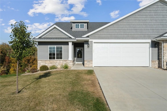 1333 Forest Ridge Ct NE, Swisher, IA 52338 - craftsman-style home with stone siding, an attached garage, concrete driveway, a front yard, and a shingled roof