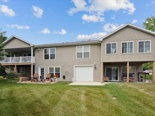 929 Willow Ln Unit A, Lisbon, IA 52253 - back of house featuring a patio, a yard, and a garage