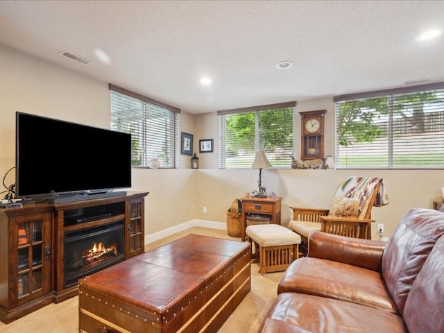 929 Willow Ln Unit A, Lisbon, IA 52253 - living area with recessed lighting, light colored carpet, and a glass covered fireplace