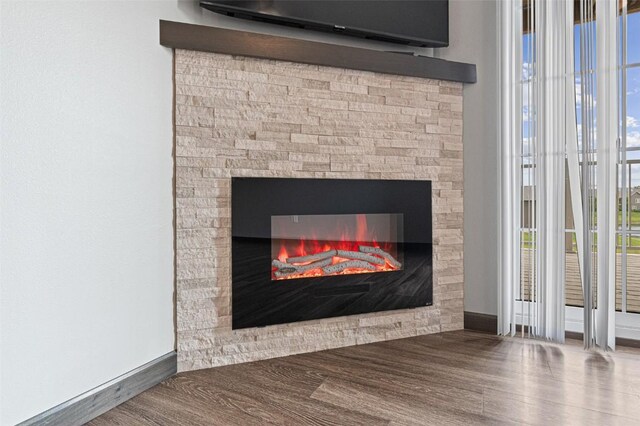 2871 Spring Rose Cir Unit 207, Coralville, IA 52241 - detailed view of wood finished floors and a glass covered fireplace