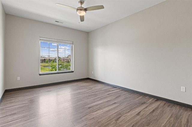 2871 Spring Rose Cir Unit 207, Coralville, IA 52241 - unfurnished room featuring wood finished floors and ceiling fan