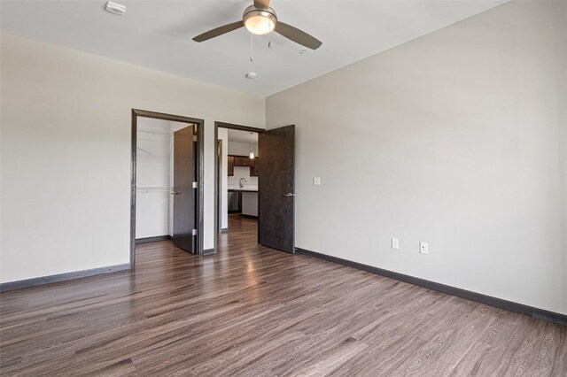 2871 Spring Rose Cir Unit 207, Coralville, IA 52241 - unfurnished room featuring dark wood-type flooring and a ceiling fan