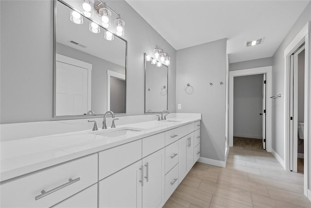 3911 Winnsboro Dr, Iowa City, IA 52245 - full bath with double vanity and baseboards