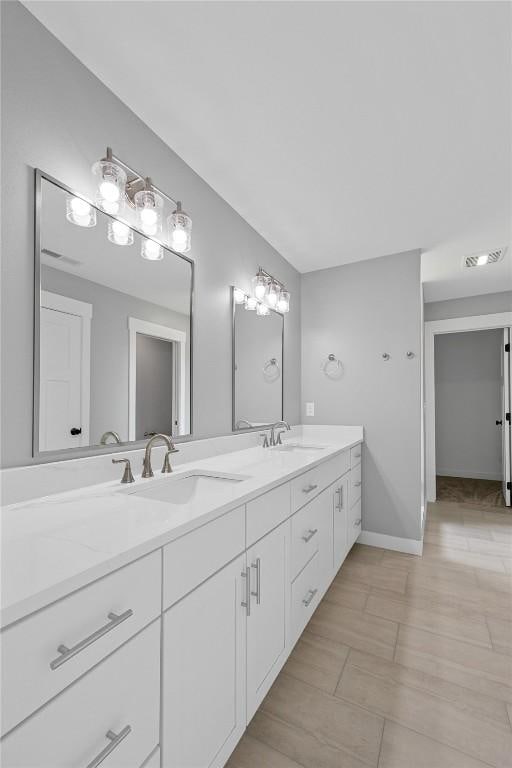 3911 Winnsboro Dr, Iowa City, IA 52245 - full bathroom with double vanity and baseboards