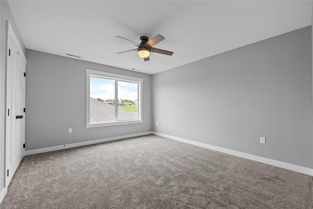 3911 Winnsboro Dr, Iowa City, IA 52245 - carpeted empty room with ceiling fan and baseboards