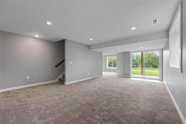 3911 Winnsboro Dr, Iowa City, IA 52245 - carpeted empty room with recessed lighting and stairway