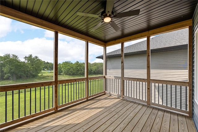 3911 Winnsboro Dr, Iowa City, IA 52245 - wooden deck with ceiling fan, a yard, and view of scattered trees
