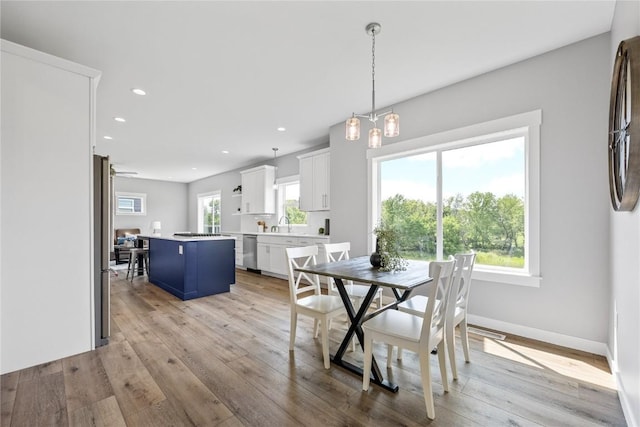 3911 Winnsboro Dr, Iowa City, IA 52245 - dining space featuring light wood-style flooring and recessed lighting