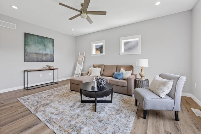 3911 Winnsboro Dr, Iowa City, IA 52245 - living room with wood finished floors, ceiling fan, and recessed lighting