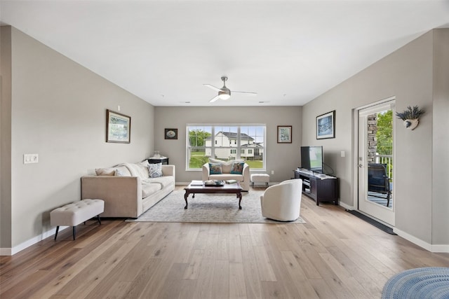 260 N Scott Blvd Unit 201, Iowa City, IA 52245 - living area with light wood-type flooring and a ceiling fan