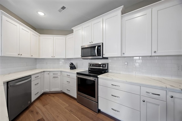 260 N Scott Blvd Unit 201, Iowa City, IA 52245 - kitchen featuring stainless steel appliances, wood finished floors, white cabinets, backsplash, and recessed lighting