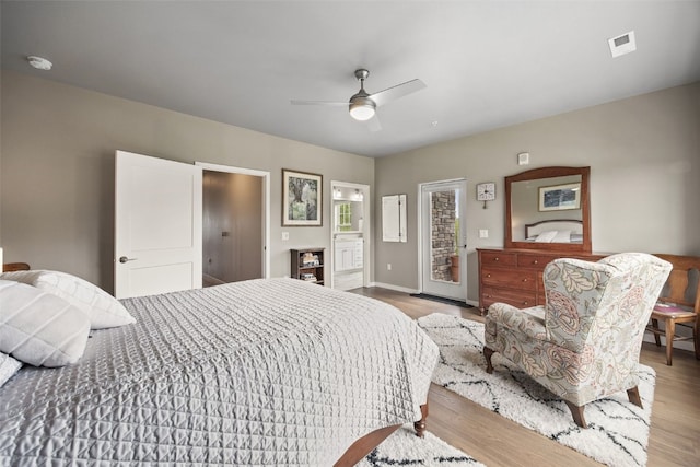 260 N Scott Blvd Unit 201, Iowa City, IA 52245 - bedroom with access to exterior, wood finished floors, and a ceiling fan