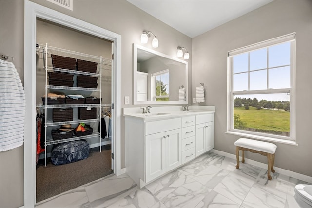 260 N Scott Blvd Unit 201, Iowa City, IA 52245 - full bathroom featuring marble finish floors and double vanity