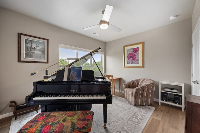 260 N Scott Blvd Unit 201, Iowa City, IA 52245 - living area featuring a ceiling fan and light wood-style flooring