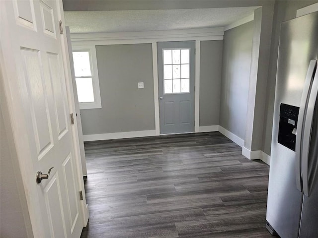 920 E Washington St, Center Point, IA 52213 - foyer entrance with plenty of natural light, dark wood-style flooring, and a textured ceiling