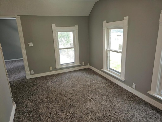 920 E Washington St, Center Point, IA 52213 - carpeted empty room with healthy amount of natural light and lofted ceiling
