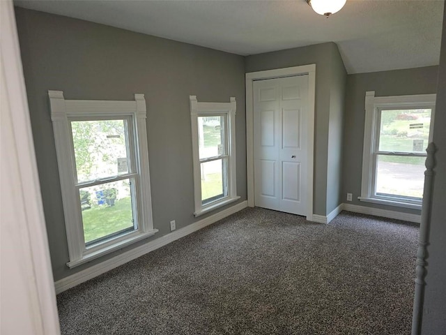 920 E Washington St, Center Point, IA 52213 - unfurnished bedroom featuring carpet and a closet