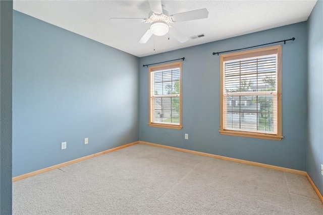 218 Teakwood Ln NE, Cedar Rapids, IA 52402 - empty room with carpet floors and a ceiling fan