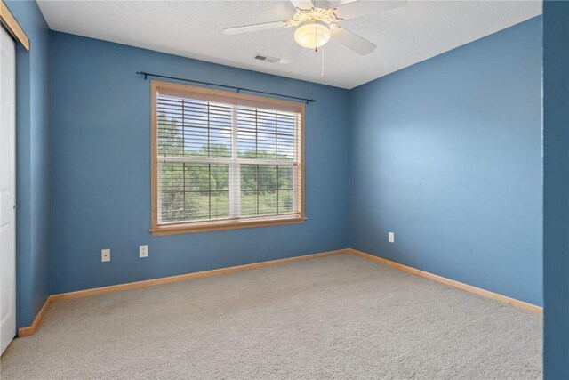 218 Teakwood Ln NE, Cedar Rapids, IA 52402 - empty room featuring carpet floors and a ceiling fan