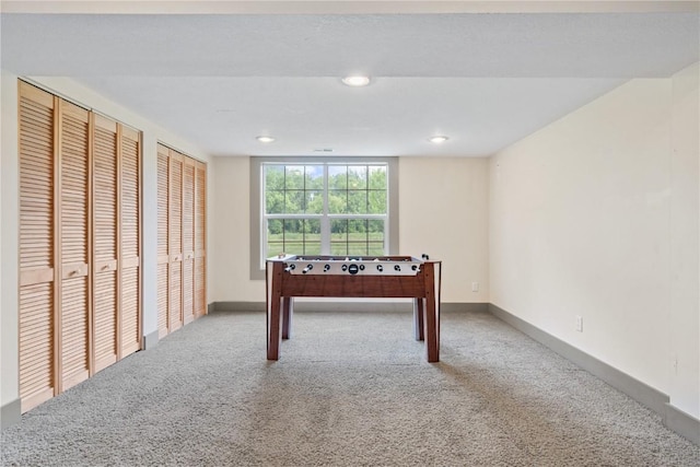 218 Teakwood Ln NE, Cedar Rapids, IA 52402 - recreation room with carpet floors and recessed lighting
