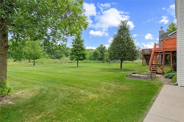 218 Teakwood Ln NE, Cedar Rapids, IA 52402 - view of grassy yard featuring stairway and a wooden deck